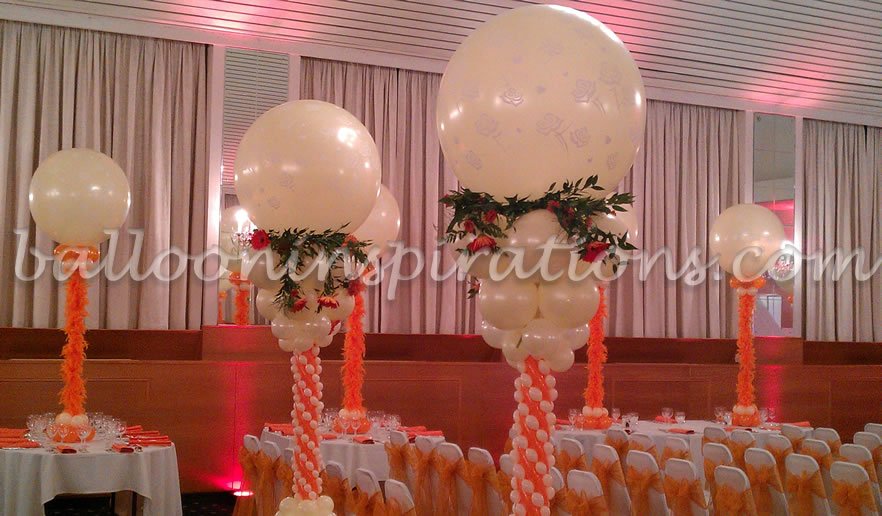 A close up of orange and ivory balloon columns