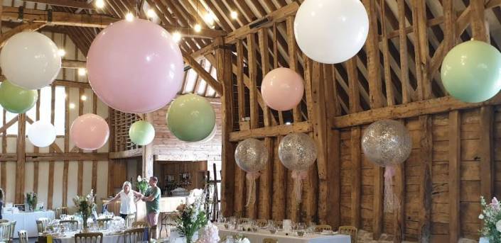 Suspended Jumbo wedding balloons - pastel colours