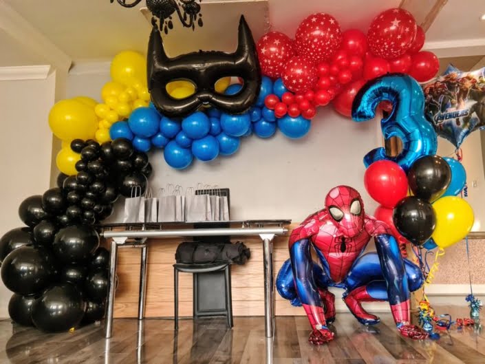 Spiderman and Batman themed balloon decorations