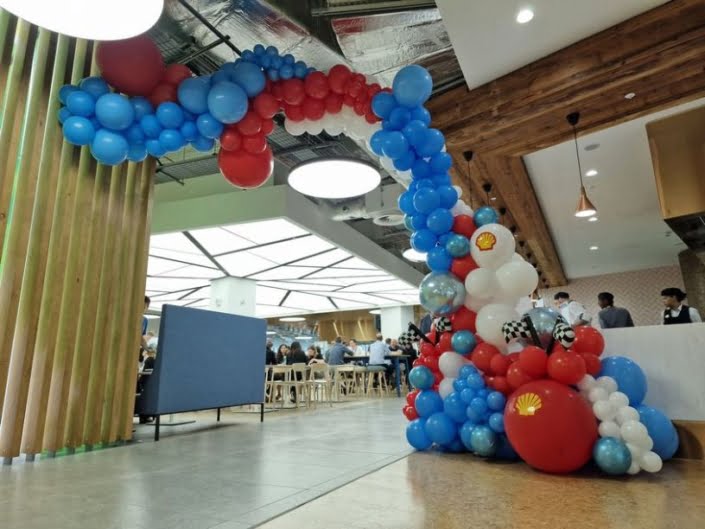 Corporate themed organic balloon arch